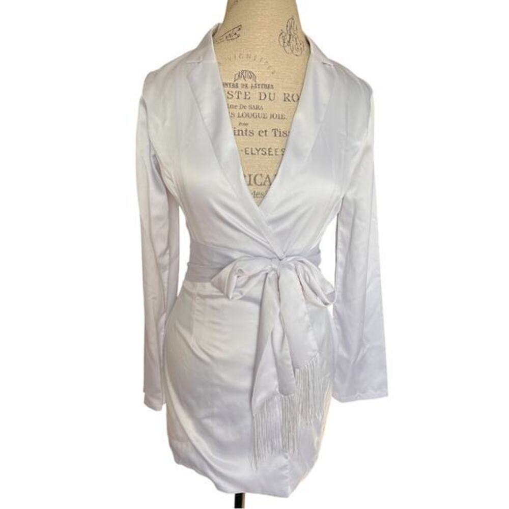 More To Come collared long sleeve dress. Tasseled tie belt, snap up, white